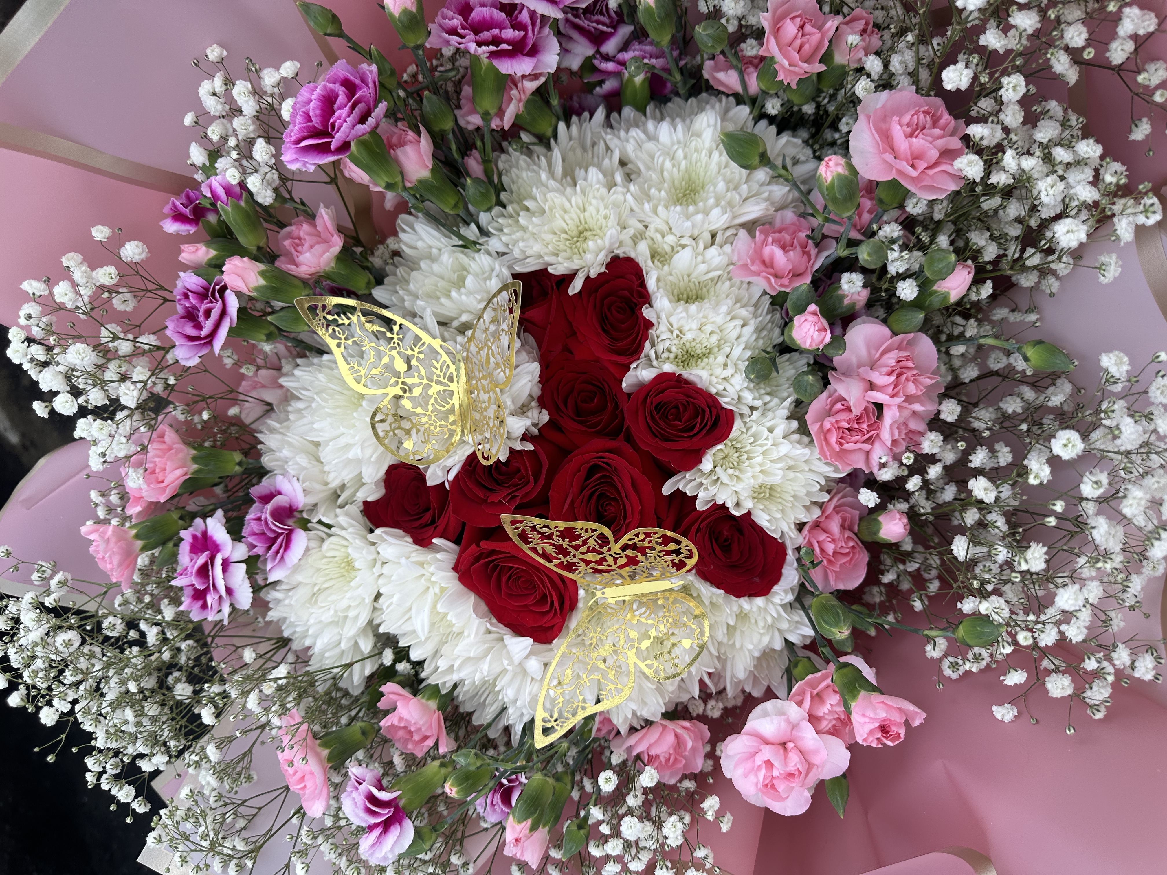 Custom bouquet with roses and butterfly accents
