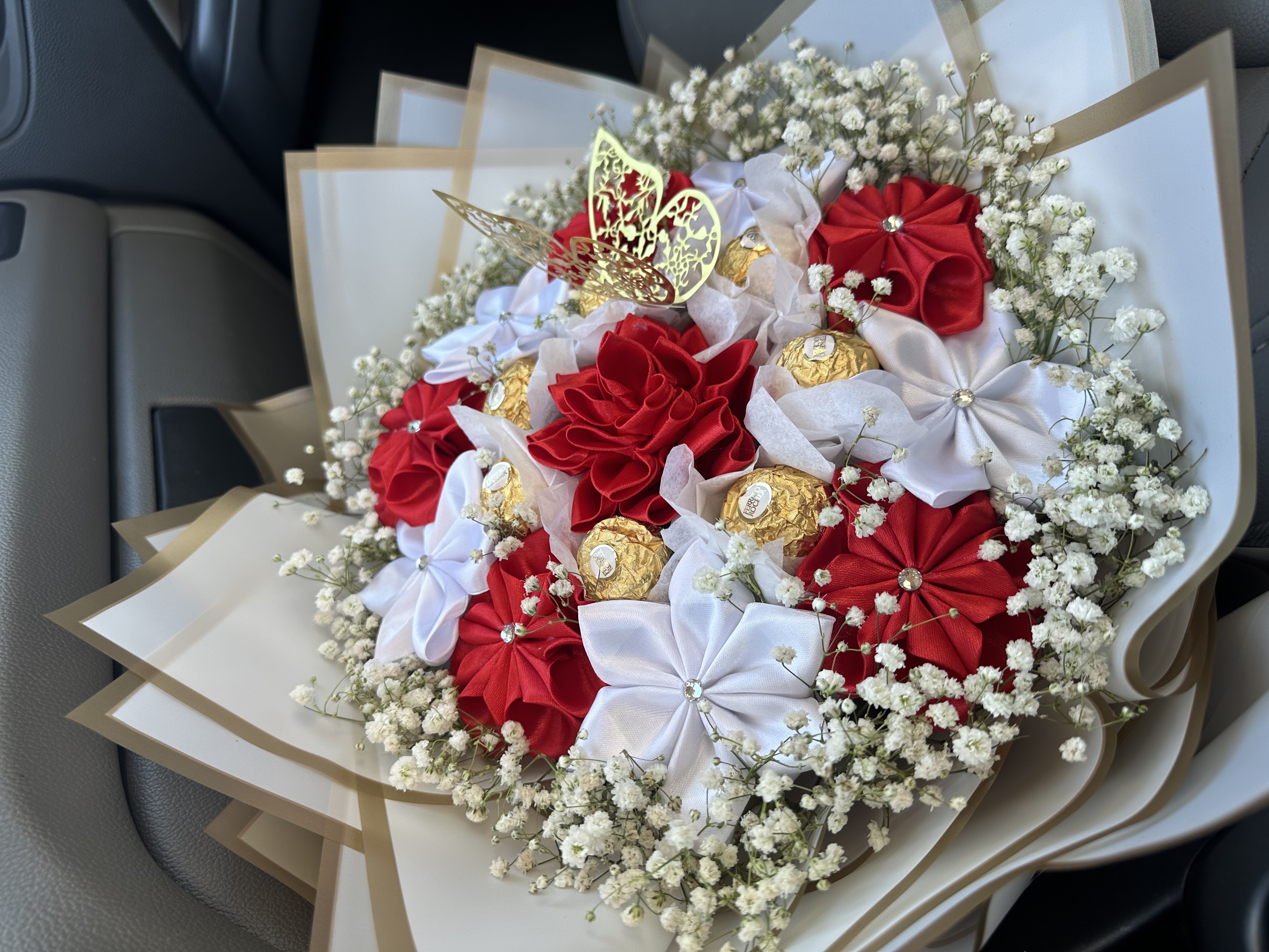 Red ribbon flowers with Ferrero Rocher chocolates