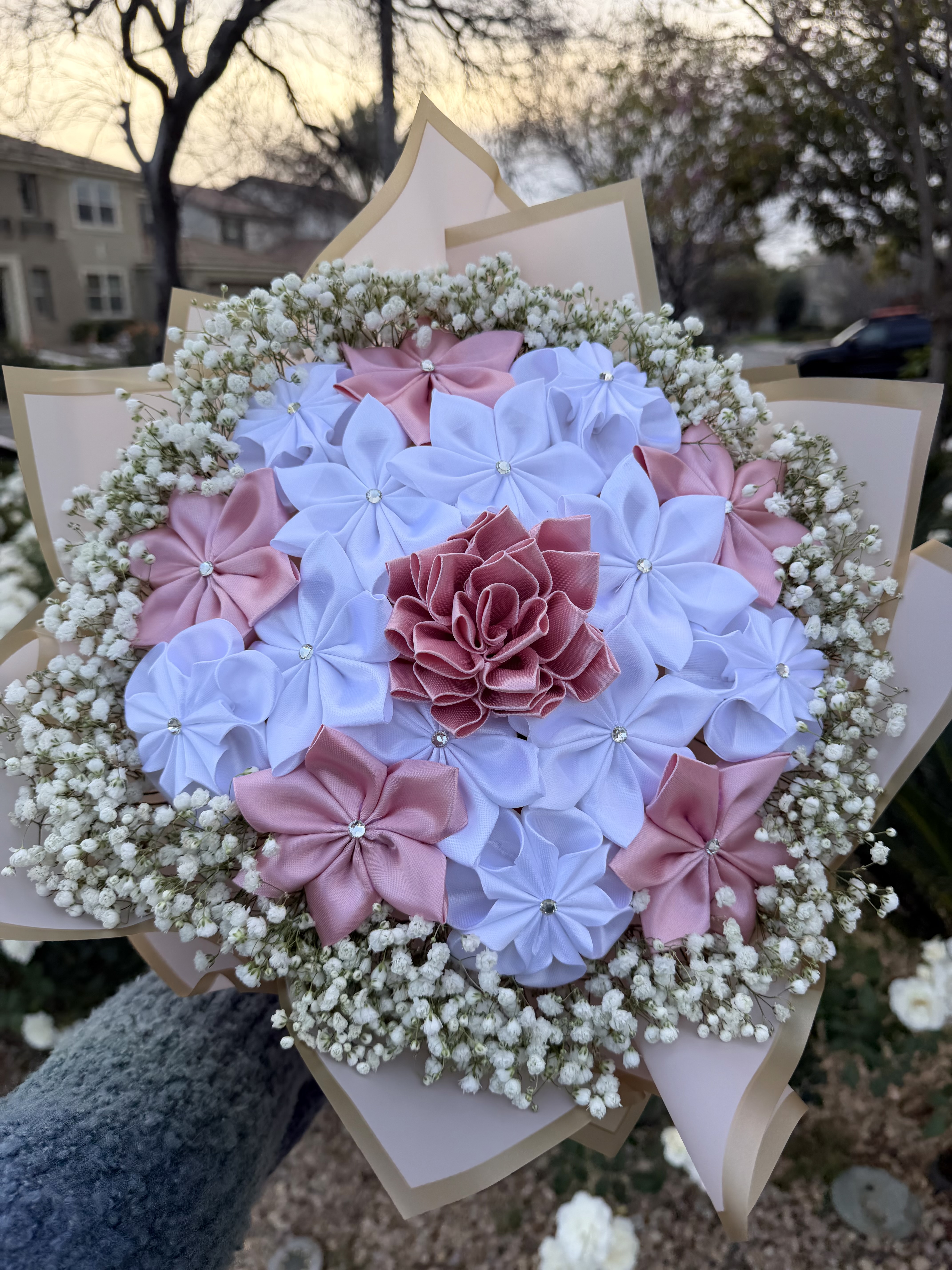 Pink and white ribbon flower bouquet with baby's breath