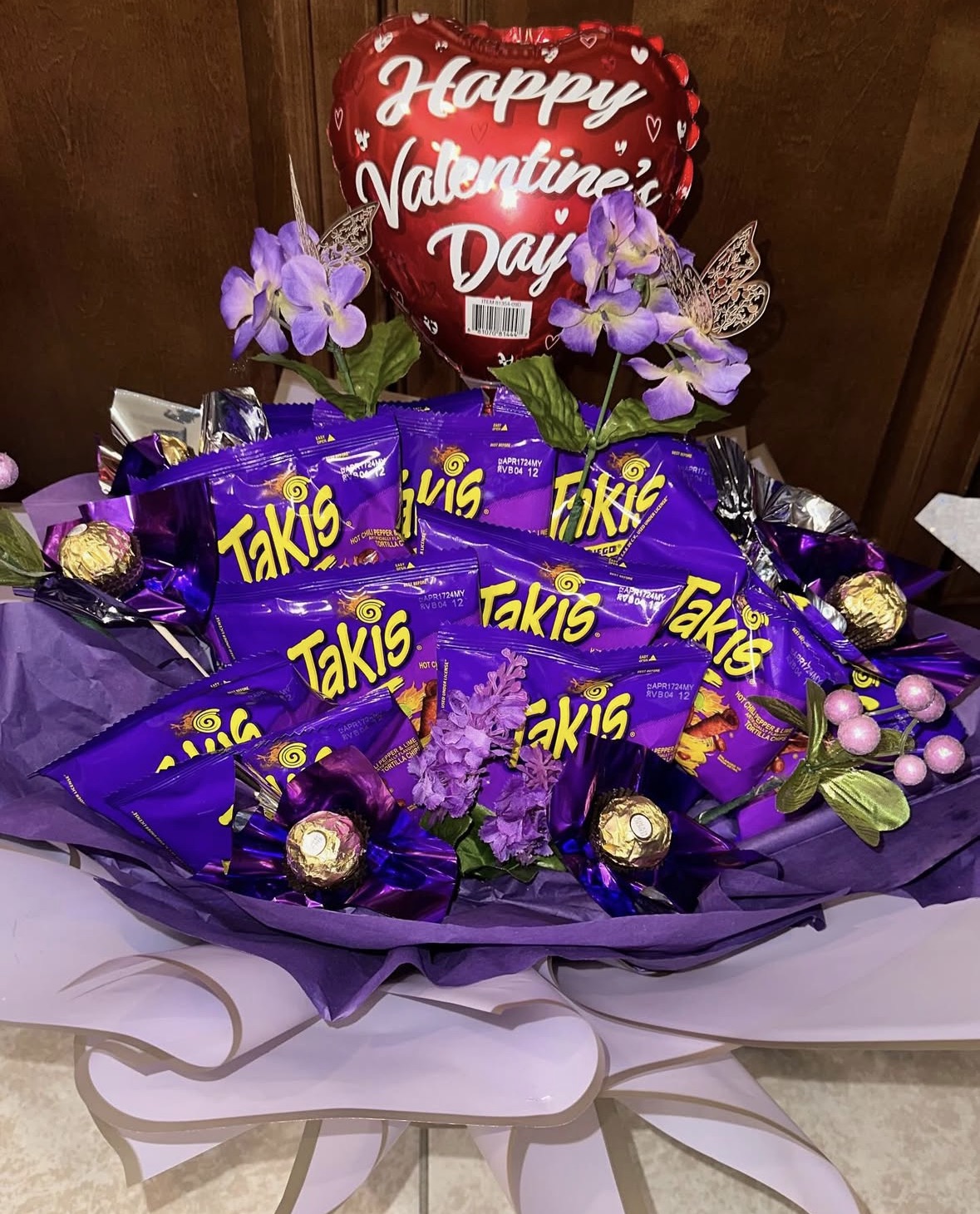 Takis snack bouquet with chocolates and Valentine's balloon